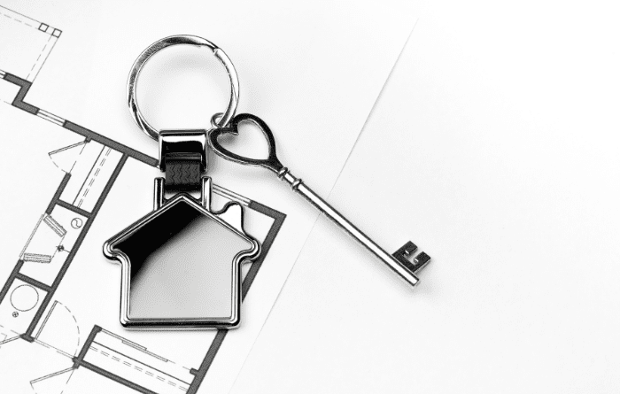 Metal house keyring on floorplan