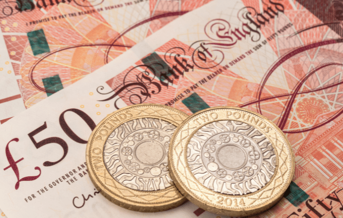 Pile of £50 notes & coins