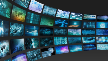 Images of screens in a curve containing visuals of graphs and diagrams