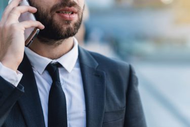 Business man in suit talking on the phone