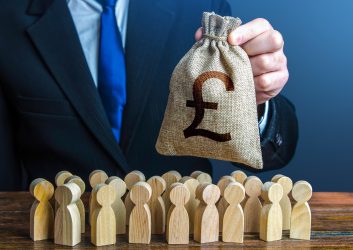 Businessman holds out a british pound sterling money bag to the crowd. Providing money, paying salaries and grants. Staff maintenance. Financial support. Tax collection. Compensation payments.