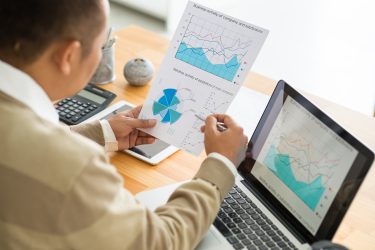 Business executive analyzing financial charts