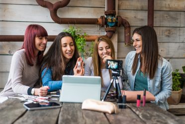 Fashion and cosmetic bloggers talking recording a vlog streaming